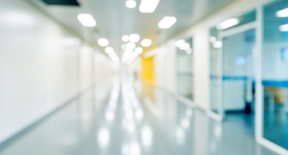 hospital hallway with hospital rooms on the right side