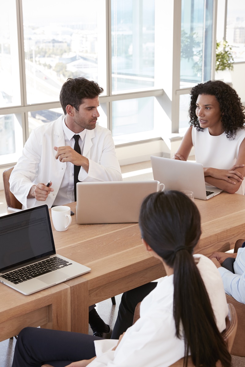 group of healthcare workers collaborating in a conference room