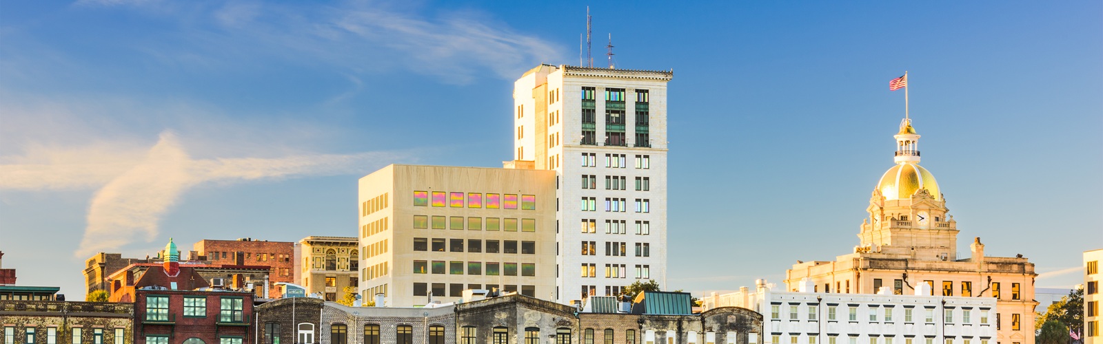 riverboats on the savannah river with the cityscape in the background