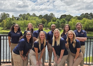 group of PTA students posing in their blue South polos outside