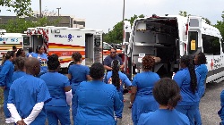 Disaster relief workers behind ambulance