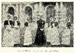 seven nurses from the early 1900s in their traditional uniforms of the time