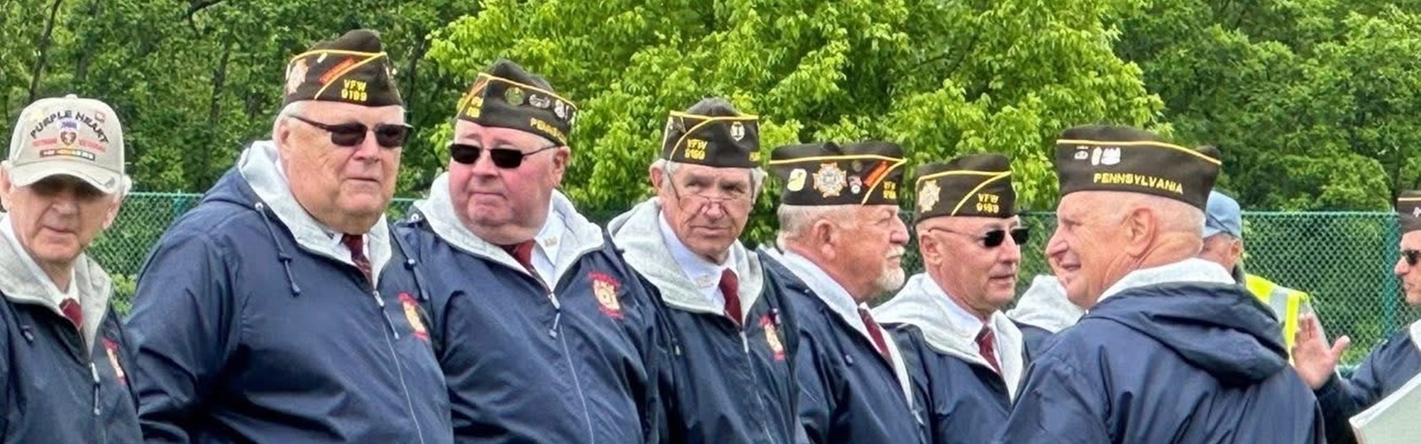 group of male VFW members standing in a line waiting for a ceremony to begin