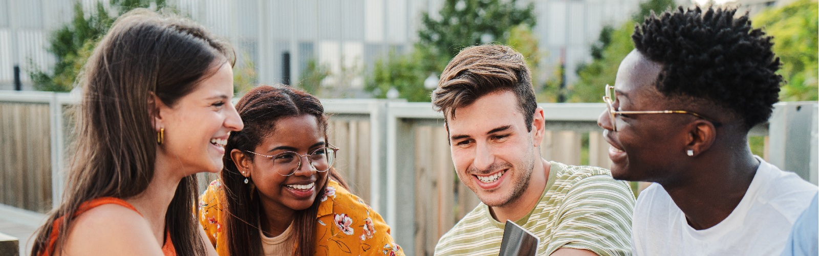 Young adults enjoying time together in backyard