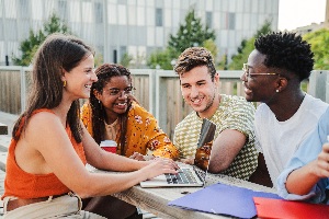 Young adults enjoying time together in backyard
