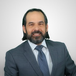 Professor Carlos Baradat Esq