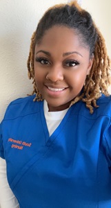Photo Dianah Silvers in her blue scrubs