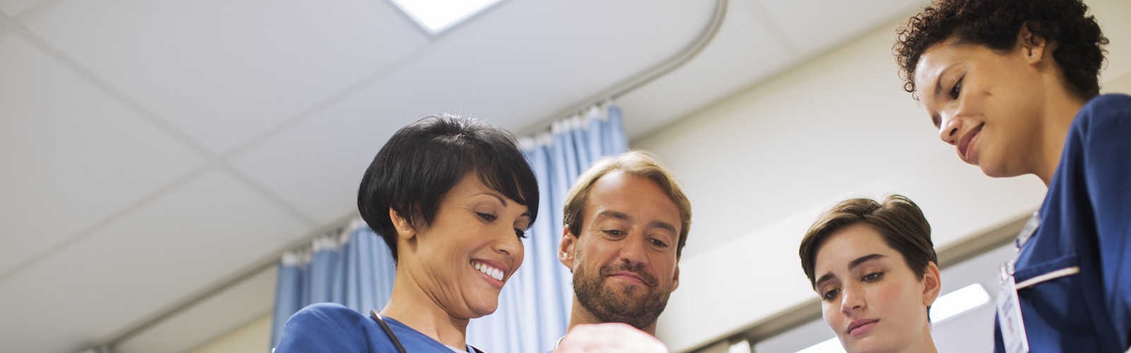 a group of nurses stand working