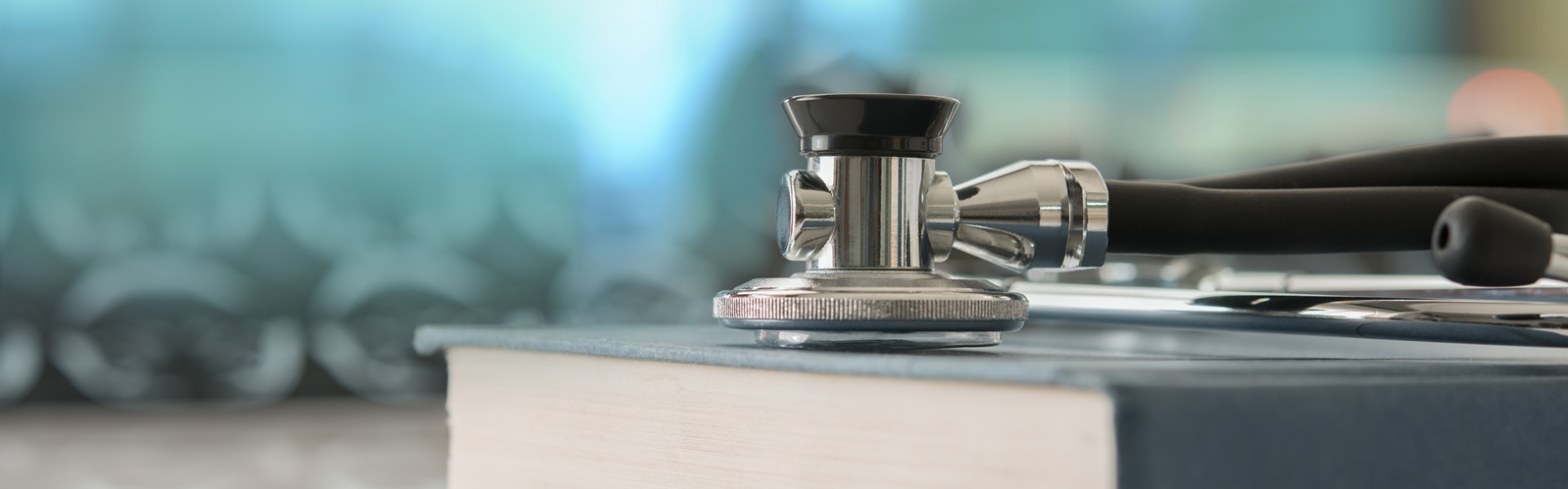 Image of a textbook and stethescope that leads to new career possibilities