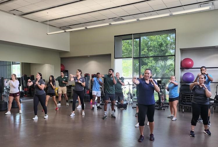 Group of people practicing boxing at a community center