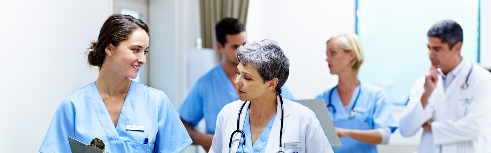 a team of medical professionals discuss their plans