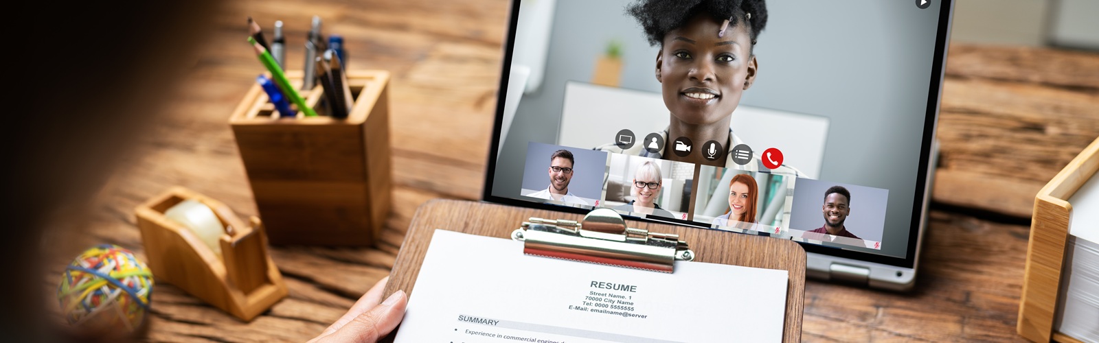 potential employers reviewing resume during digital interview