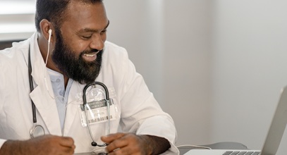 A male nurse working on a computer
