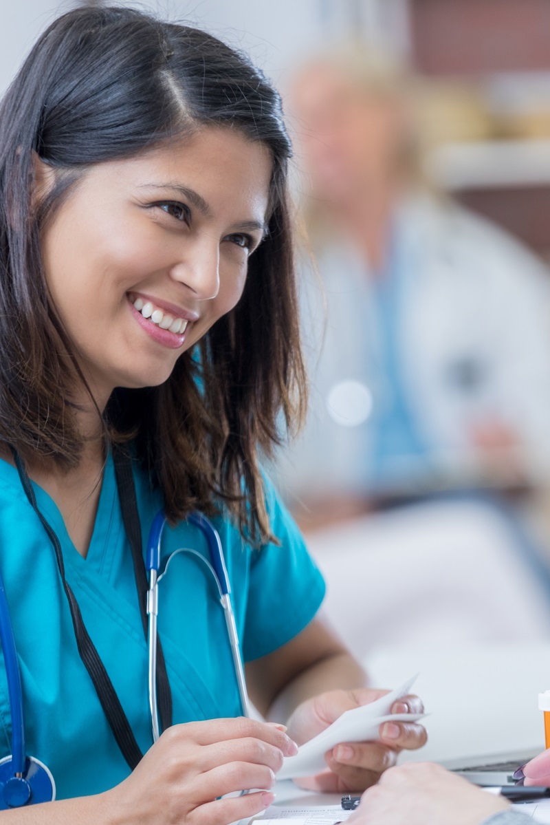 Advanced Practice Nurse consulting a patient