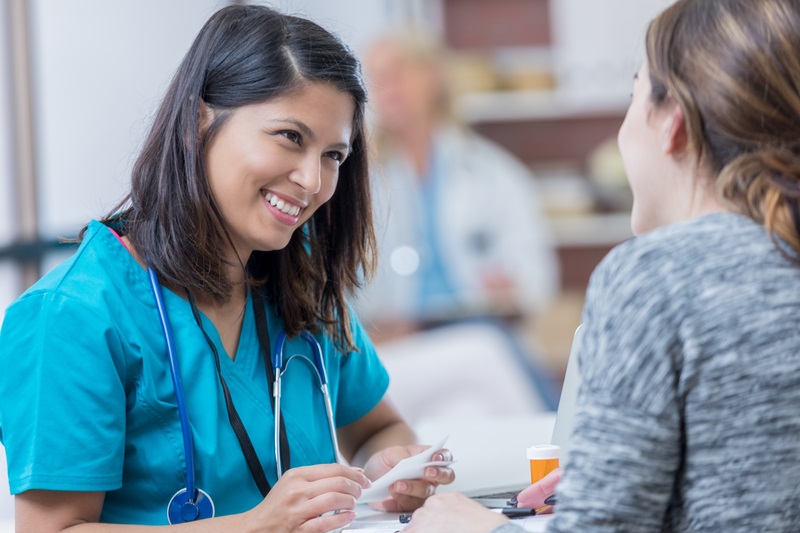 Advanced Practice Nurse consulting a patient