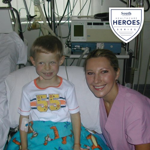 Julia Canipe in hospital room with child patient