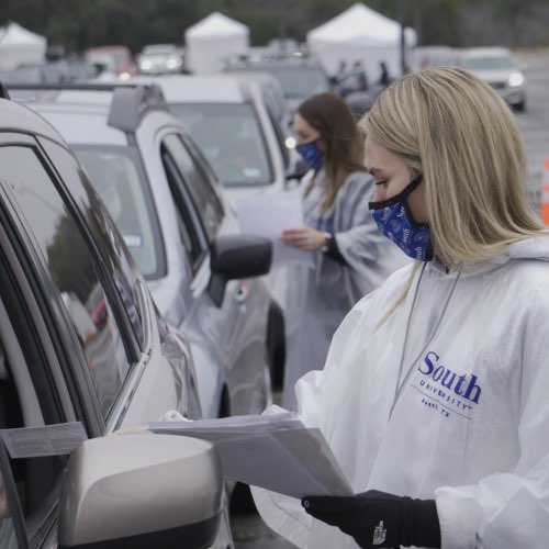 South University nursing student speaking to patient in car