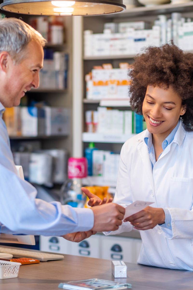 Female pharmacist consulting with patient