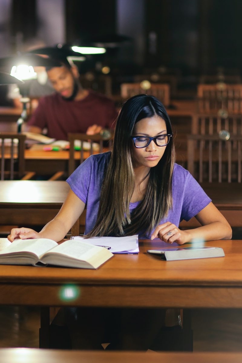 Female student in library studying