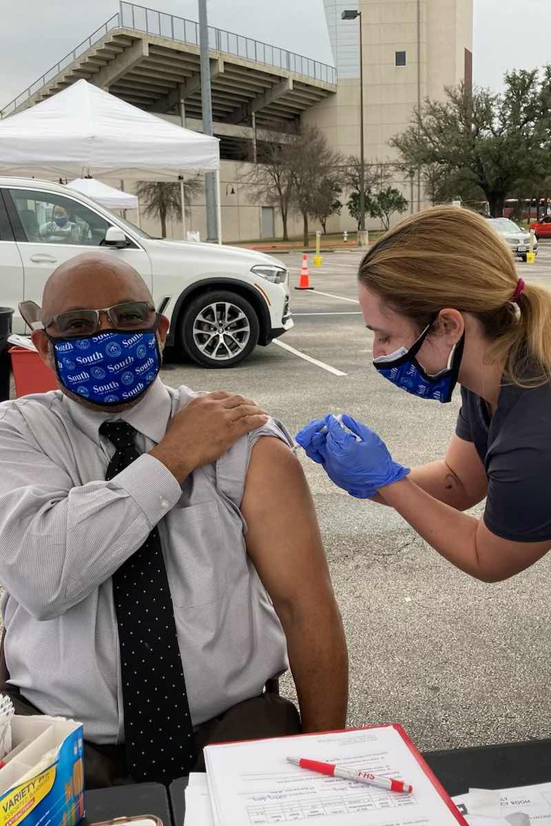 South University student administering the COVID-19 vaccine