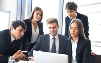 Young business professionals reviewing information
