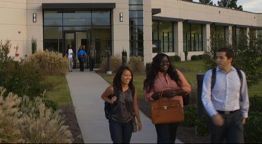 South University building with students walking in front