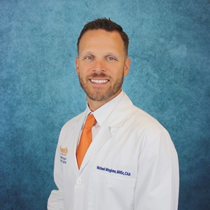 Michael Mingione headshot in white coat