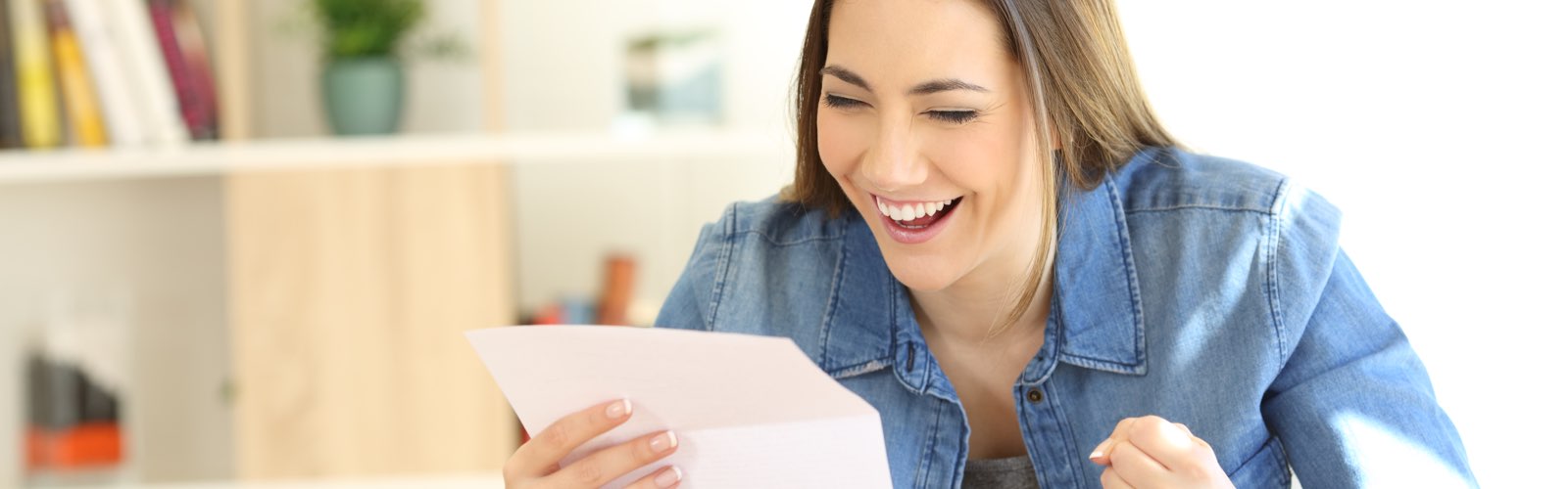 Female student reading acceptance letter
