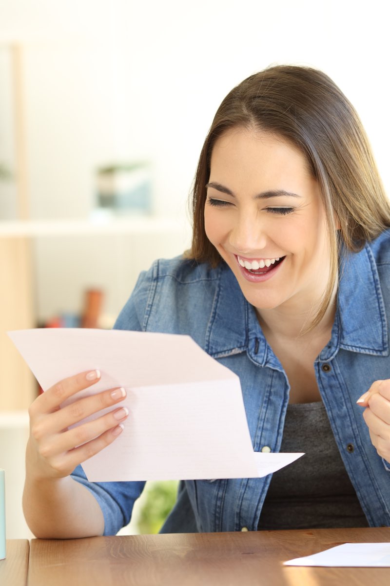 Female student reading acceptance letter