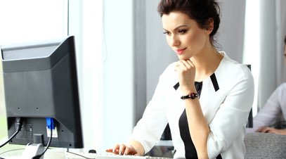 Female accountant viewing information on computer-alt-text