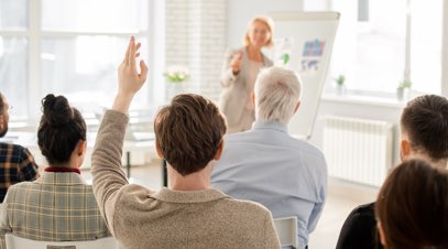 Teacher in front of class teaching students