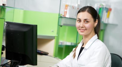 Femaile healthcare administrator sitting at computer