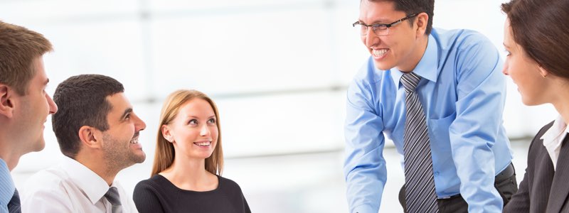 Group of human resources professionals having a discussion and smiling