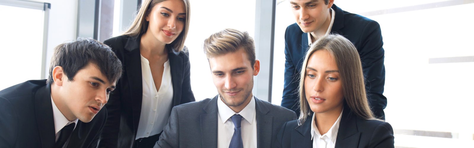 Young business professionals reviewing information