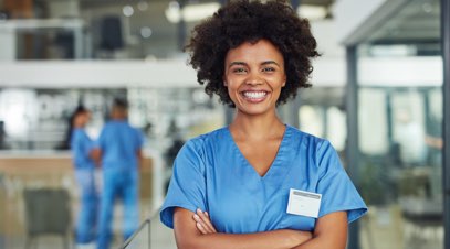 Female nurse in hospital smiling-alt-text