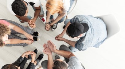 Group therapy session from above-alt-text