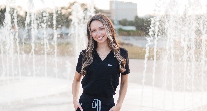 Alexa Isabel Obregon posing in her nursing scrubs