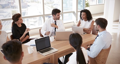 group of healthcare workers collaborating in a conference room