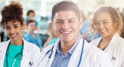 2 women and one male hospital staff standing together