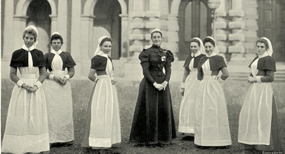 seven nurses from the early 1900s in their traditional uniforms of the time