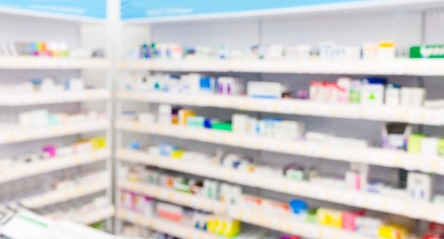 Shelves lined with pharmaceuticals in a pharmacy