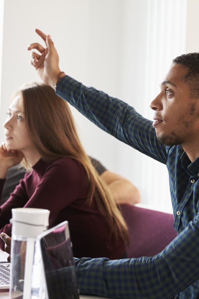 male student raising hand