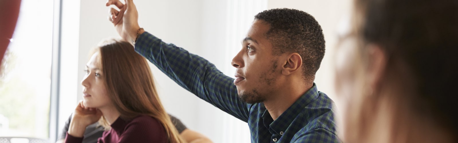 male student raising hand