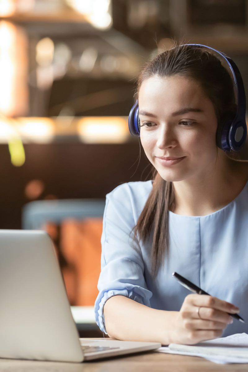 Woman on laptop studying at home