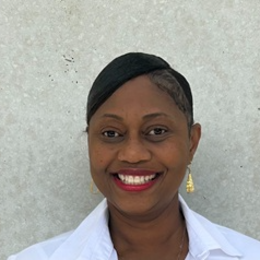 Nikisha Clouden headshot in a white shirt