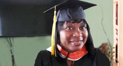 Sabrina Summerset wearing her cap and gown from South University graduation